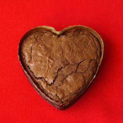 Close-up of heart shape on red surface