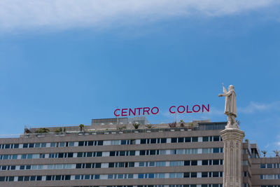 Low angle view of building against blue sky