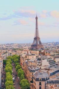 Eiffel tower in city against sky