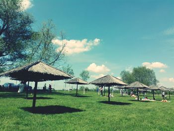 Gazebo by trees against sky