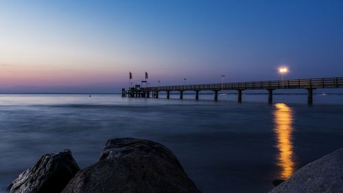 Scenic view of sea against sky at sunset