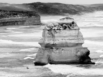 Scenic view of rock formation in water