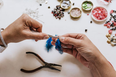 High angle view of woman hand on table
