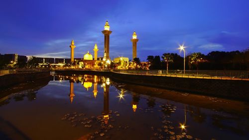 Reflection of illuminated buildings in water