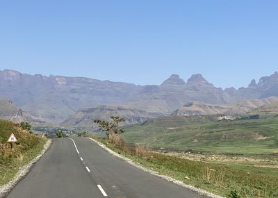 Road amidst landscape against clear sky