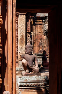 Statues on old temple outside building