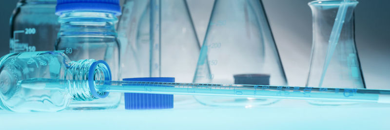 Close-up of laboratory glassware on table