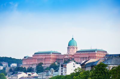 Buildings in city against sky