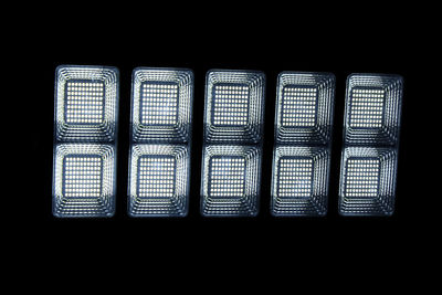 Close-up of blinds against black background