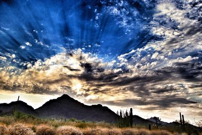 View of landscape against cloudy sky