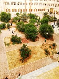 High angle view of people walking on street in city