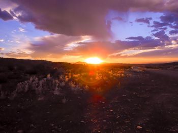 Scenic view of landscape against sky during sunset