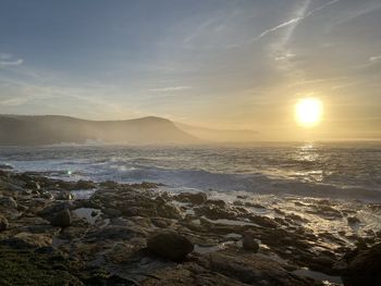 Scenic view of sea against sky during sunset