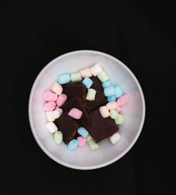 High angle view of multi colored candies in plate