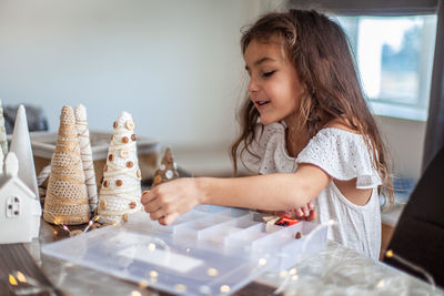 Cute girl playing on table