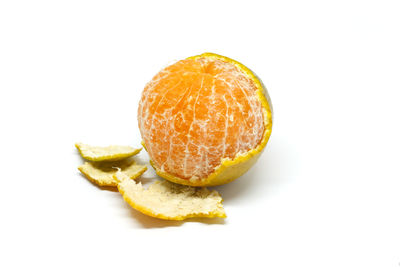 High angle view of orange slice against white background