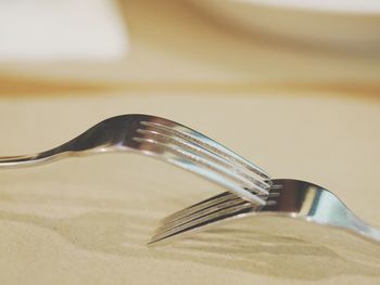 Close-up of forks on table