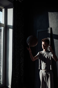 Full length of young man looking at camera