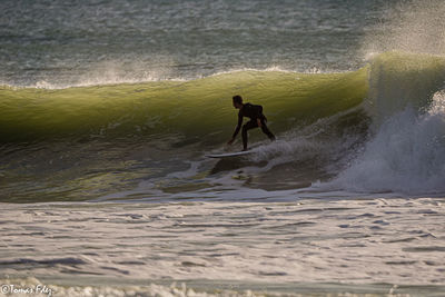 Man surfing in sea