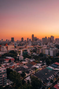 High angle view of buildings against clear sky at sunset