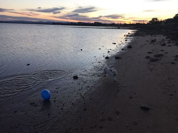 Scenic view of beach at sunset