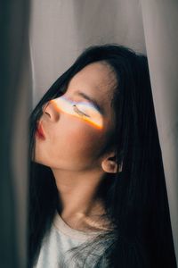 Prism light falling on woman eye