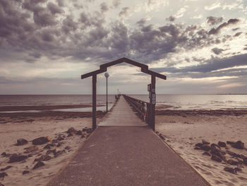 Scenic view of beach against sky during sunset