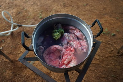 High angle view of meat in cooking pan