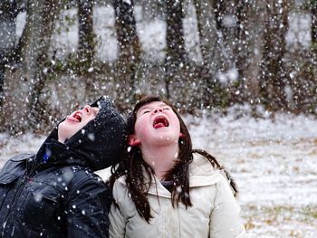 Woman with ice cream in snow