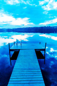 Empty pier over calm lake