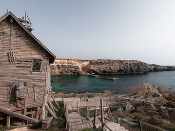 Panoramic view of sea and buildings against clear sky