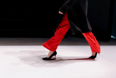 Low section of woman standing on floor