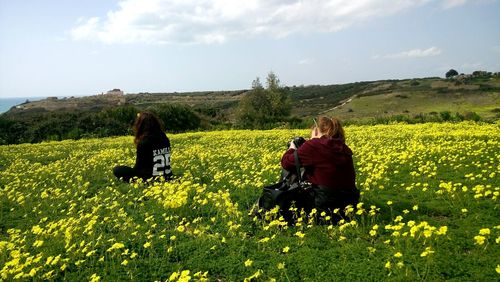 Rear view of couple in a field