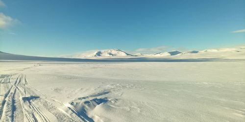 Scenic view of snowcapped mountains against sky