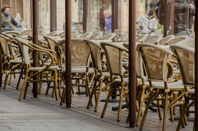Empty chairs and table in building