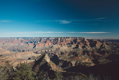 Scenic view of landscape against blue sky