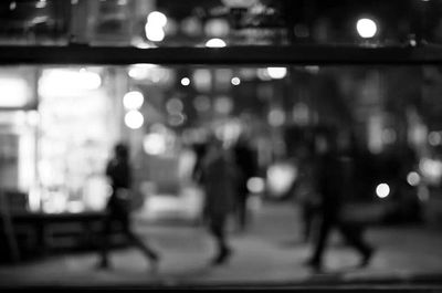 Defocused image of illuminated city at night