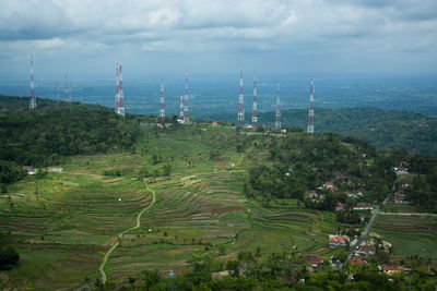 Views of green rice fields in gunungkidul village, yogyakarta with many towers