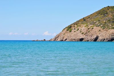 Scenic view of sea against blue sky