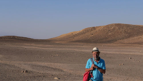 Senior man walking in the desert 
