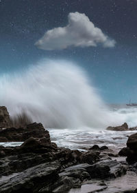 Big wave with clouds at the ocean