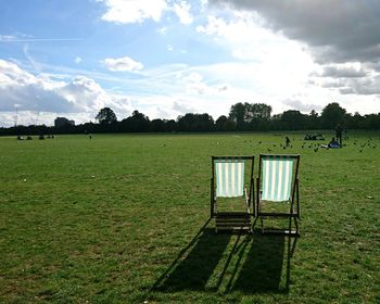 Built structure on field against sky