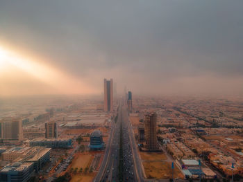 High angle view of cityscape against sky during sunset