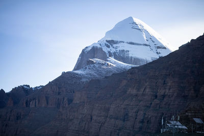 Scenic view of snowcapped mountains against clear sky