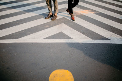 Low section of people crossing road