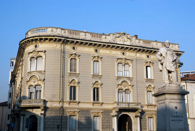 Low angle view of historical building against blue sky