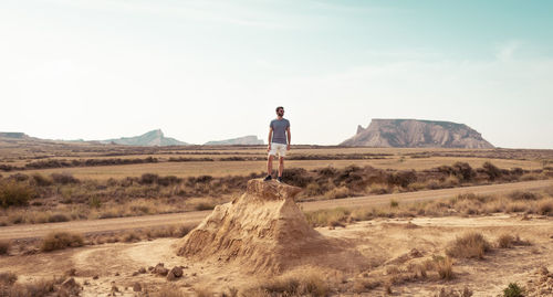 Standing man in the desert. 
