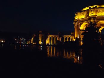 Low angle view of illuminated building at night