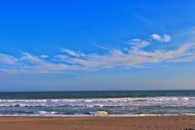 Scenic view of sea against blue sky