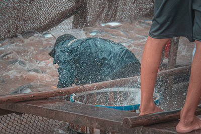 Man working at shore